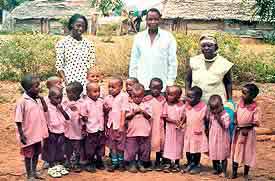 Miriam (teacher), Joshua (manager) and Miriam (the cook) together with the KiD kids